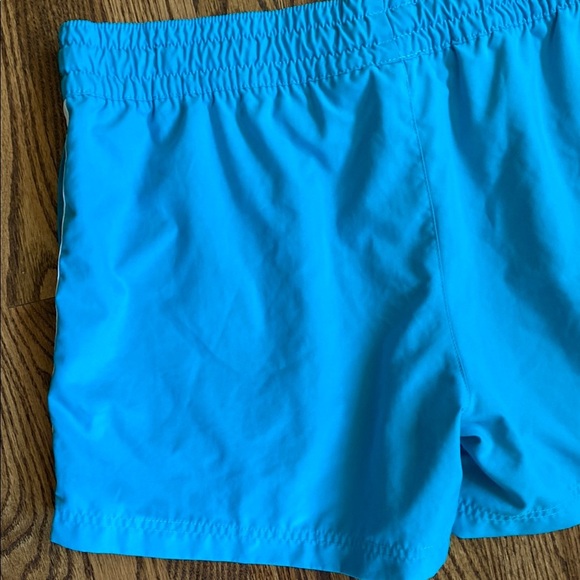 Bright turquoise with white side stripe Nike shorts with pockets, size women’s L - Picture 6 of 16